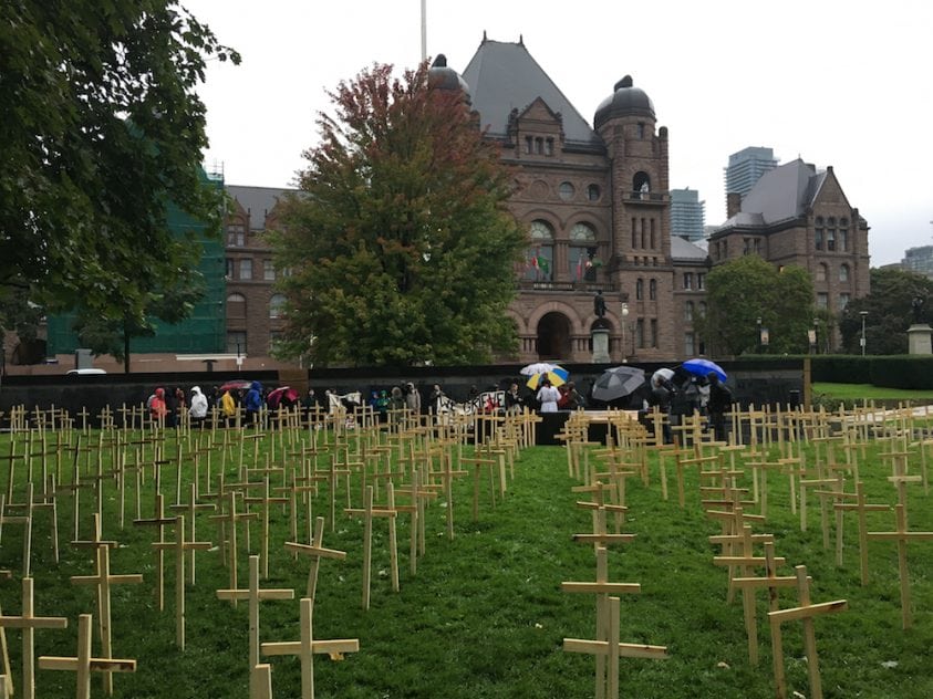 Protesters erect crosses on legislature’s lawn as government defers decision on supervised injection sites